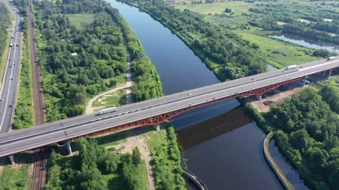 Drone flying above bridge spanning river valley Video stock 322956318
