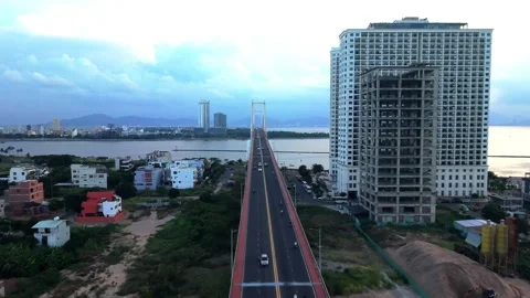 Drone Flying Above Bridge Toward Da Nang Skyline at Dawn Vídeo Stock 340458304