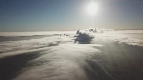 Drone flying above clouds and winter forest Video stock 334180599