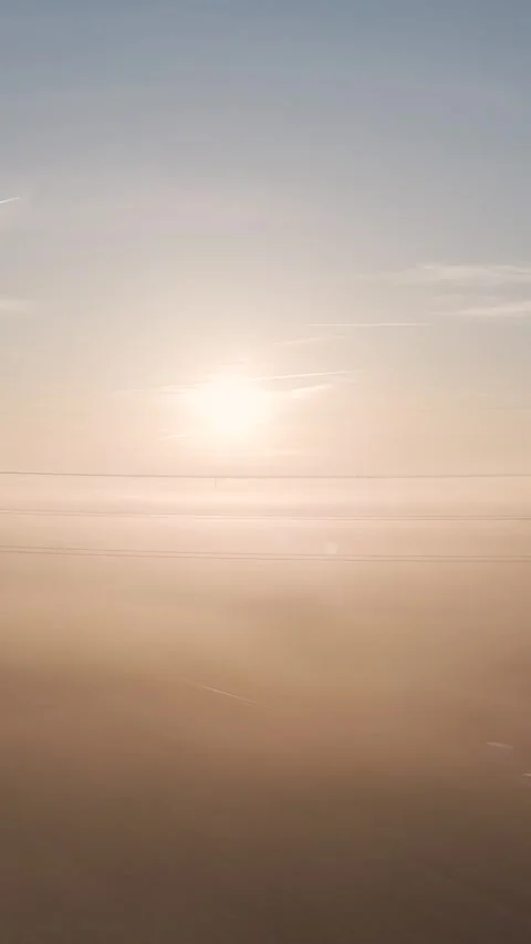 Drone flying above the clouds during sunrise over a foggy landscape Stock Footage 327114104