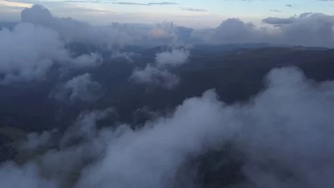 Drone flying above the clouds in the mountains Stock Footage 93035006