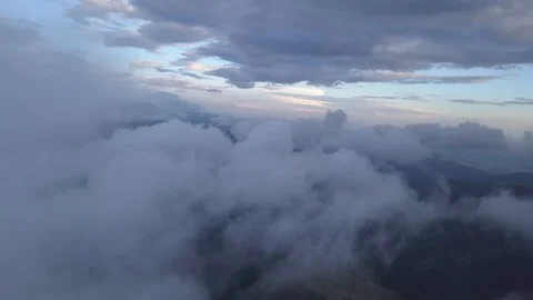 Drone flying above the clouds in the mountains Stock Footage 93035059