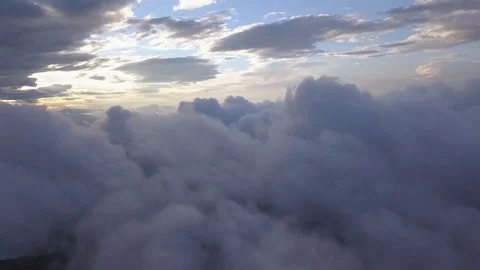Drone flying above the clouds in the mountains Stock Footage 93035069