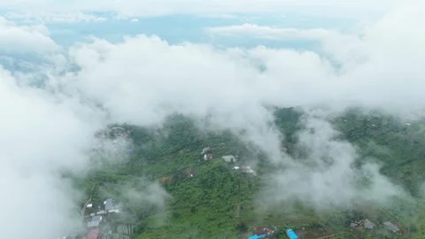 Drone flying above clouds over munduk village bali Stock Footage 328914382