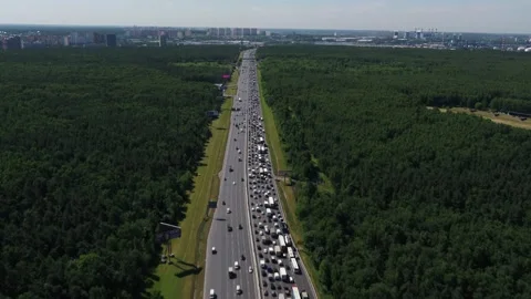 Drone flying above crowded highway through forest Stock Footage 321370258