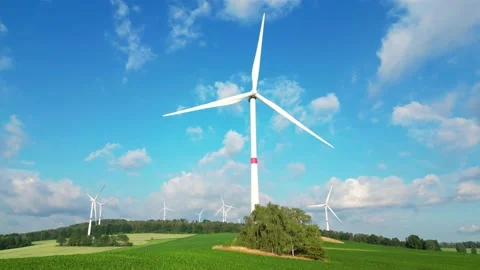 Drone flying above field looking at wind farm Stock Footage 199398048
