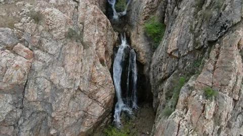 Drone flying above hidden waterfall in the rocky mountains Stock Footage 154223660