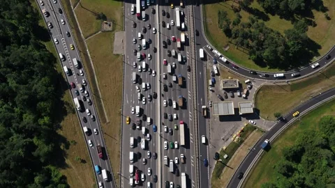 Drone flying above highway interchange with heavy traffic Stock Footage 321370025