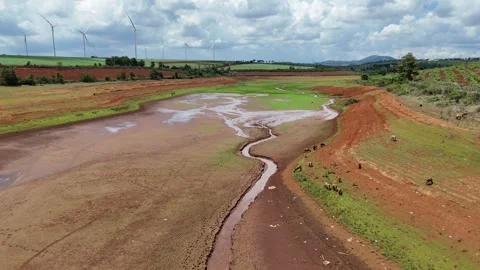Drone flying above low-water river and green riverbed in Gia Lai 動画素材 337404686