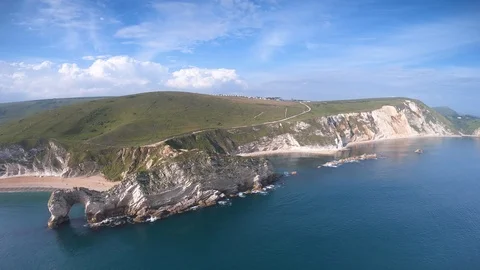 Drone flying above Man of War Bay and Durdle Door. Dorset, UK Stock Footage 112550540