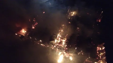 Drone flying above multi-building farm land inferno Stock Footage 66652523