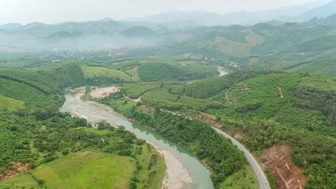 Drone flying above rainforest river surrounded green jungle and mountains. Stock Footage 168618072