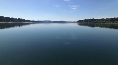 Drone Flying Above the Reflective Pacific Northwest Inlet Water Stock Footage 62577880