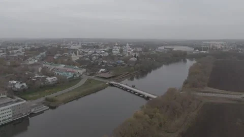 Drone flying above river toward Kolomna churches, D-log Video stock 330427992