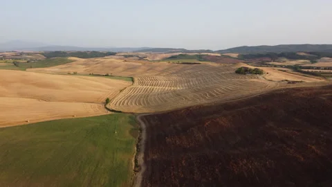 Drone flying above rolling tuscan farmland Stock Footage 319555590