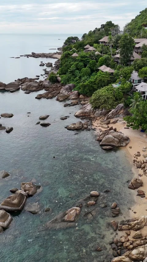 Drone Flying Above a Tropical Island Resort Coastline in Koh Samui, Thailand Stock Footage 335832053