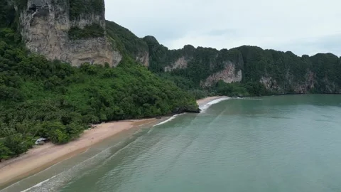 Drone Flying Above a Tropical Sandy Beach and Cliffs in Ao Nang, Krabi, Thailand Stock Footage 334717022