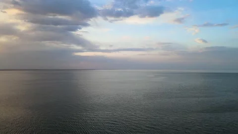 Drone flying above a very large lake that has small waves.  Stock Footage 155169319