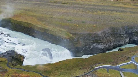 Drone flying above the waterfall Gullfoss, famous landmark in Iceland Stock Footage 233034048