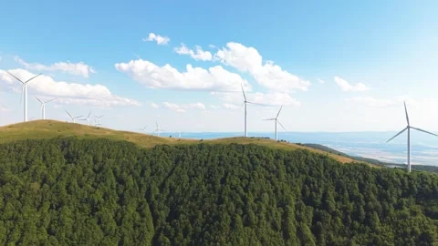 Drone Flying Above Wind Turbines in the Central Balkans on a Bright Cloudy Day Stock Footage 313546218