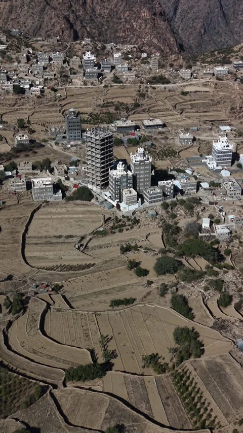Drone flying above yafa'a mountainous village in yemen Stock Footage 343911628