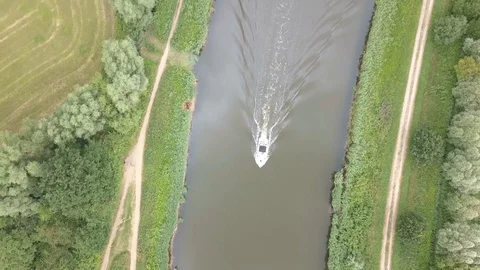 Drone flying across a river above a boat Stock Footage 112653897