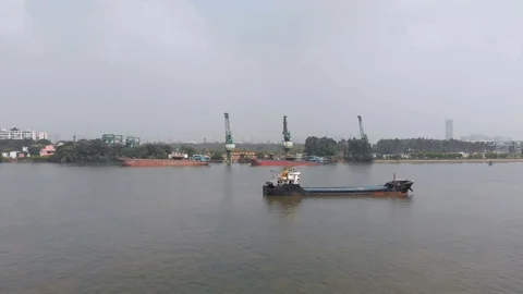 Drone flying across the river to the loading port. Stock Footage 117922969