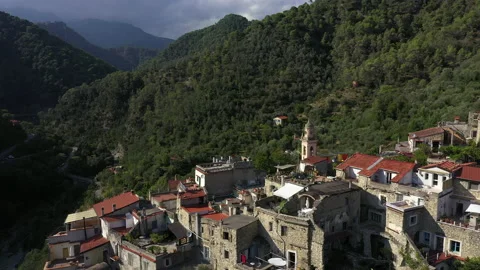 Drone flying across rooftops and terraces in old village in Italian mountains. Stock Footage 138829965