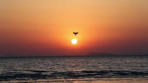 Drone flying against sunset sky Stock Footage 75245678