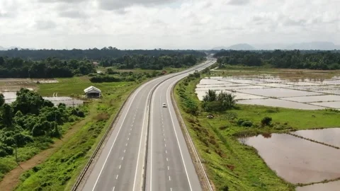 Drone flying from the air down to the roadway Stock Footage 292966102