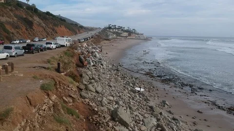 Drone Flying Along Beach and Road Stock Footage 84747744