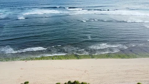 Drone flying along the beach with waves Stock Footage 153009151
