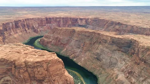 Drone flying along beautiful massive red Horse Shoe Bend canyon, 4K aerial video Video stock 134568073