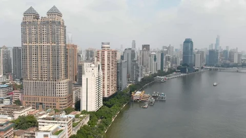 Drone flying along the embankment of a large metropolis. Stock Footage 118113853