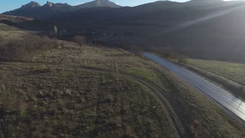 Drone flying along a mountain road Stock Footage 84546010