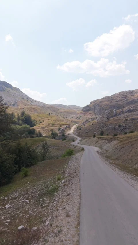 Drone Flying Along Mountain Road and Ascending Over Visocica Landscape, Bosnia Vídeo Stock 342717491