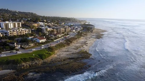 Drone flying alongside the shore of La Jolla, San Diego with beautiful Stock Footage 100997365
