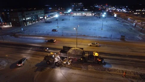 Drone flying and showing large scale snow removal vehicles in function Video stock 103654053