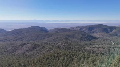 Drone Flying from Apache Point Observatory Towards Forest Mountain Horizon Stock Footage 307485459
