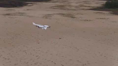 Drone flying around another drone 動画素材 84938468