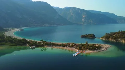 Drone flying around the beautiful peninsula of Oludeniz beach. Stock Footage 196986719