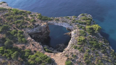 Drone Flying around Cave in Cala Varques in 60 FPS 4K Stock Footage 100266237