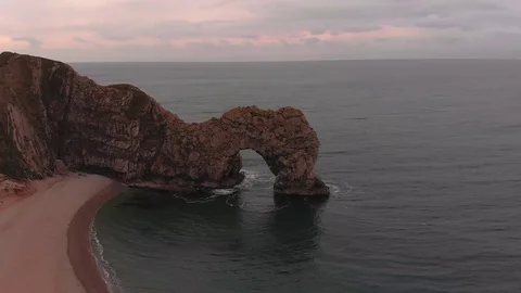 Drone Flying Around Durdle Door, Dorset at Sunrise 스톡 동영상 106410908