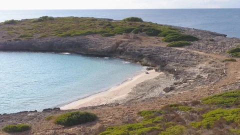 Drone flying around empty beach in Mallorca 스톡 동영상 100265895