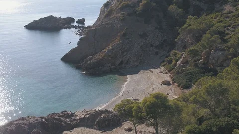 Drone flying around empty stone beach Stock Footage 100266725