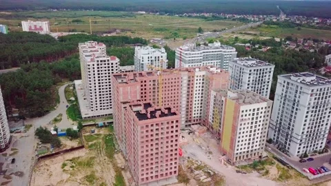 Drone flying around a housing complex, construction site. Building from the sky Stock Footage 159442237