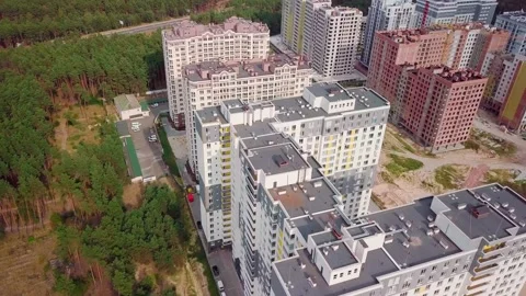 Drone flying around a housing complex, construction site. Building from the sky Stock Footage 159442272
