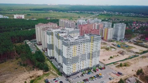 Drone flying around a housing complex, construction site. Building from the sky Stock Footage 159443136