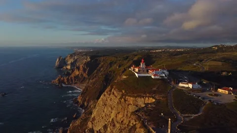 Drone flying around lighthouse on the sunset, Cabo do Roca, Portugal Stock Footage 199222210