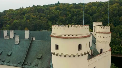 Drone flying around the main tower of castle orlik in czech republic also the Vidéo 329471122